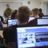 Students attend a cyberdefense class in a school in Poltsamaa, Estonia, in December 2015. | REUTERS