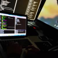 A student types code on a computer during a cyberdefense programming class in the \"War Room\" at Korea University in Seoul in November 2015. | BLOOMBERG