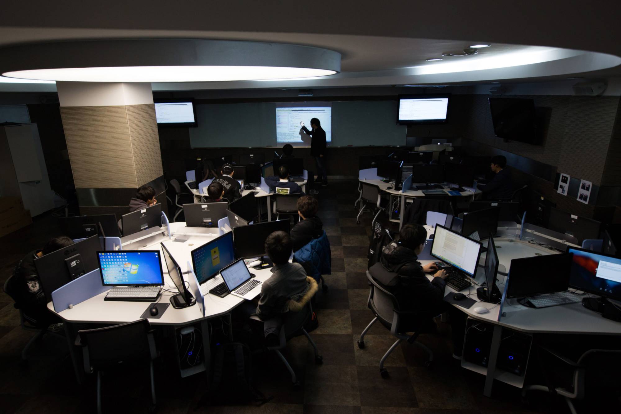 Students sit at computers during a cyberdefense programming class in the 'War Room' at Korea University in Seoul in November 2015. | BLOOMBERG