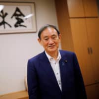 Yoshihide Suga poses for an interview with Reuters in Tokyo on Aug. 26, when he was still the chief Cabinet secretary. | REUTERS