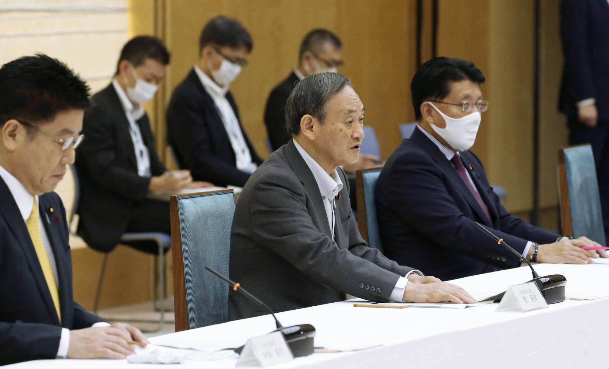 Prime Minister Yoshihide Suga speaks at the first meeting of all ministers to promote Japan's digital transformation at the Prime Minister's Office on Wednesday. | KYODO
