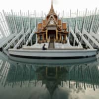 A shrine at the entrance of Rangsit University in the outskirts of Bangkok. Thailand — aging and short of skilled workers — can ill-afford to continue avoiding the issue of its faltering education system. | REUTERS