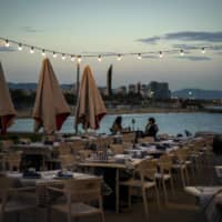 A nearly empty restaurant in Barcelona, Spain, on Wednesday. Spain is struggling to contain a second wave of the coronavirus.  | AP