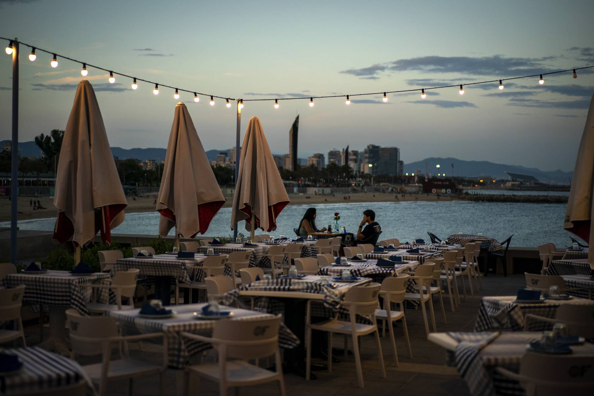 A nearly empty restaurant in Barcelona, Spain, on Wednesday. Spain is struggling to contain a second wave of the coronavirus.  | AP