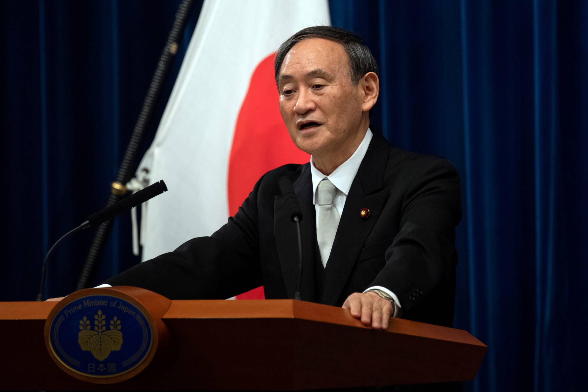 Prime Minister Yoshihide Suga speaks during a news conference on Sept. 16. | REUTERS