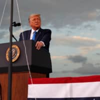 U.S. President Donald Trump speaks during a campaign rally at Cecil Airport in Jacksonville, Florida, on Thursday. | REUTERS