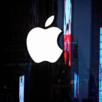 Apple charges a commission of between 15 percent and 30 percent for apps that use its in-app payment system and sets out extensive rules for apps in its App Store. | AFP-JIJI