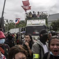 Thousands of protesters gather in front of the Grand Palace in Bangkok on Sept. 19. Women, many of them students, are speaking out against a patriarchy that controls the military, the monarchy and the Buddhist monkhood, Thailand’s most powerful institutions. | ADAM DEAN / THE NEW YORK TIMES