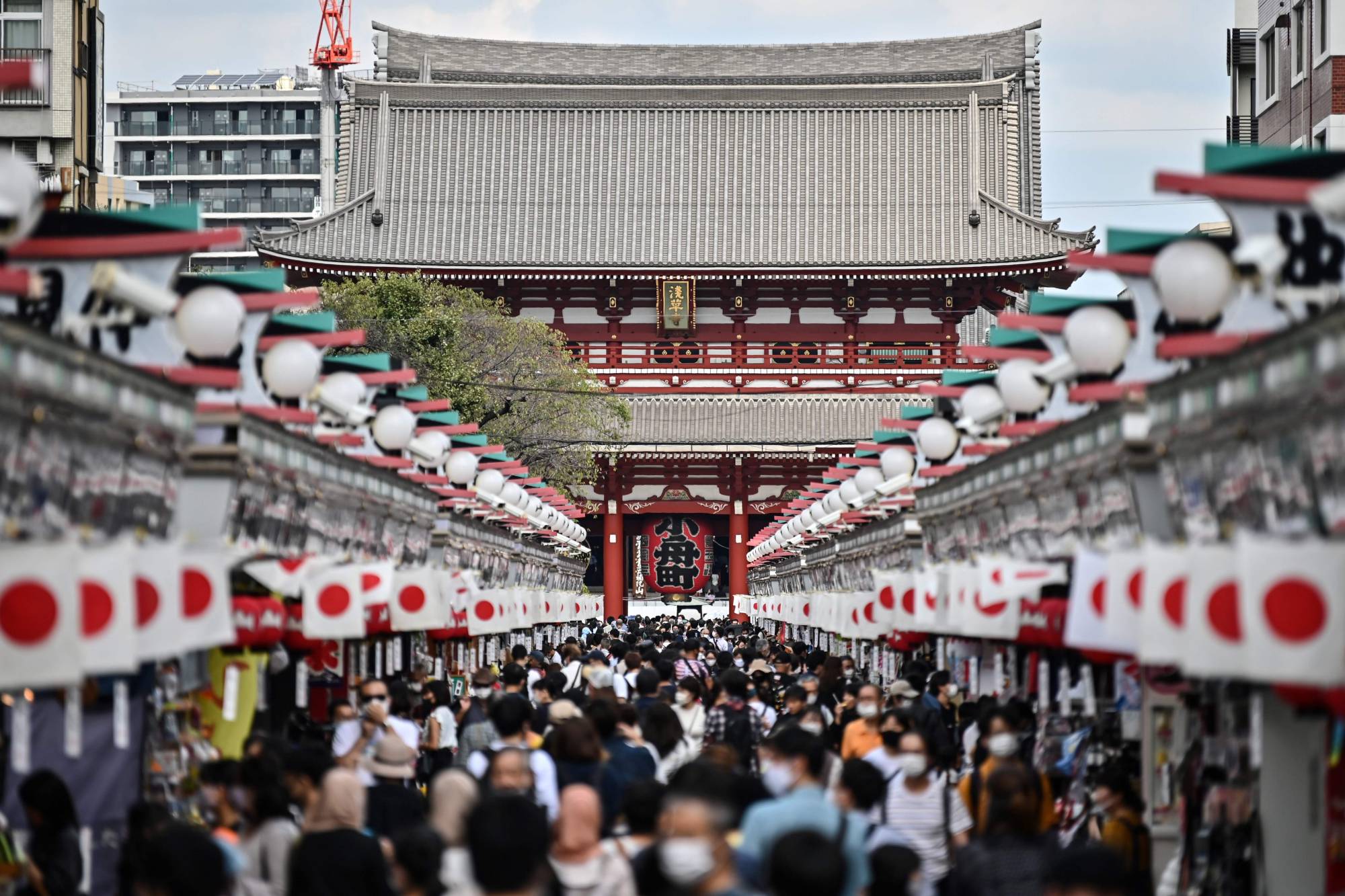 People visit Sensoji temple in Tokyo's Asakusa district on Tuesday. | AFP-JIJI
