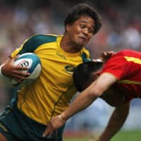 Brackin Karauria-Henry (left), seen representing Australia during the Hong Kong Sevens tournament in March 2010, is one of three players affected by a Japan Rugby Football Union ruling declaring that foreign-born players with Japanese passports will be treated as non-Japanese if they are not eligible to play for the Brave Blossoms. | REUTERS