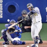 Naomasa Yokawa hits a home run against the Dragons on Sept. 18 in Nagoya. | KYODO