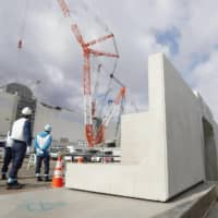 A seawall is being constructed at the Fukushima No. 1 nuclear power plant in January.  | KYODO 

