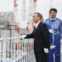 Prime Minister Yoshihide Suga visits the disaster-stricken Fukushima No. 1 nuclear power plant on Saturday. | KYODO