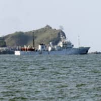 A South Korean government ship near Yeonpyeong island, South Korea, on Saturday | NEWSIS / VIA AP