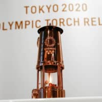 The Olympic Flame is seen on display in a lantern at the Japan Olympic Museum in Tokyo on Aug. 31. | REUTERS