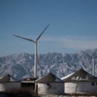 Wind turbines near Beijing. China\'s surprise pledge to slash its carbon footprint to zero by 2060 has been met with cautious applause. | AFP-JIJI
