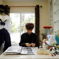 Thai designer Tin Tunsopon works in his studio in Bangkok.  | REUTERS 