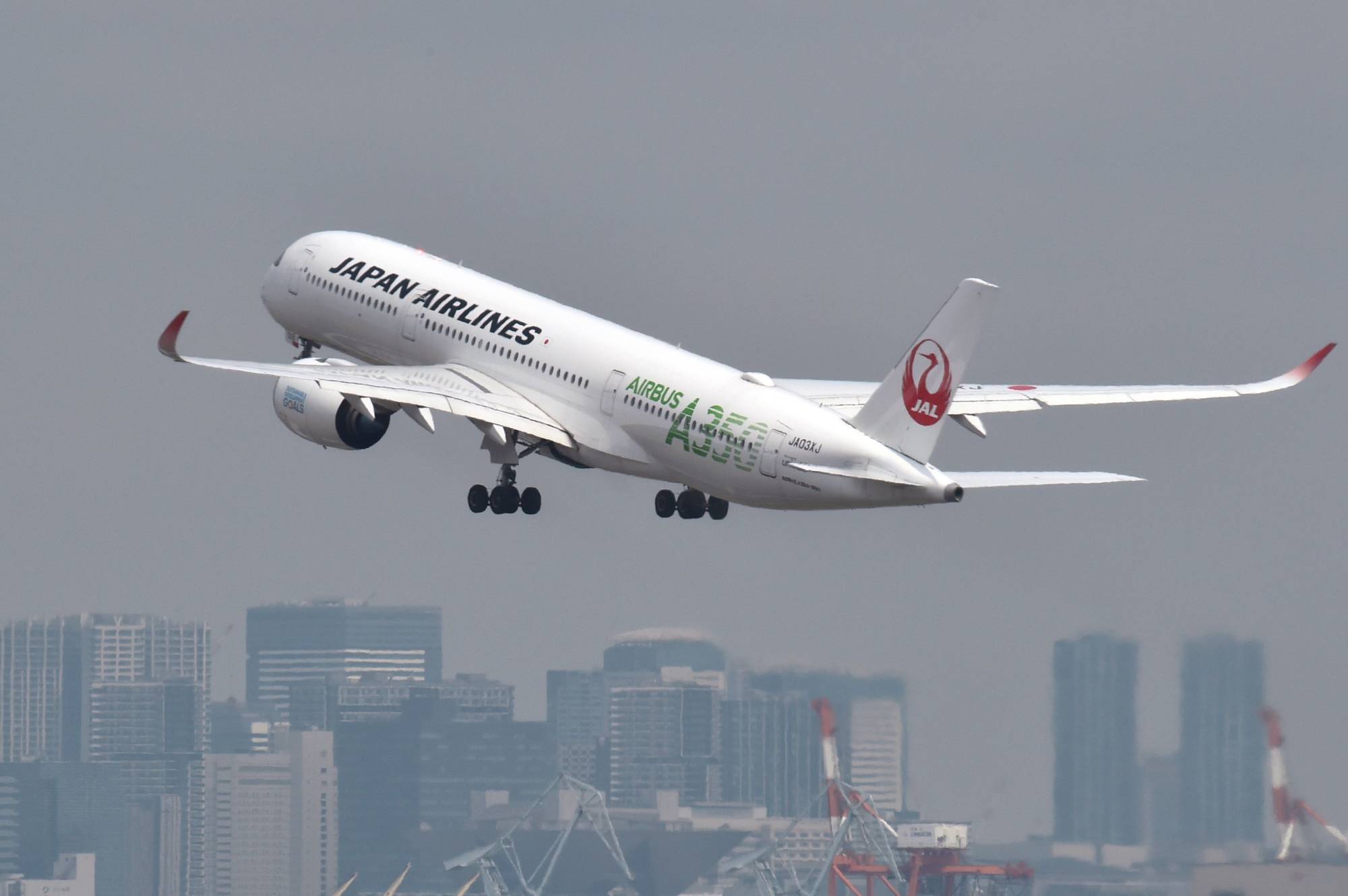 Japan Airlines is ditching the phrase 'ladies and gentlemen' at airports and on flights for gender-neutral terms. | AFP-JIJI