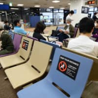 Travelers from among the 159 countries covered by the entry restrictions with higher numbers of infections will be required to meet stricter entry conditions. | BLOOMBERG