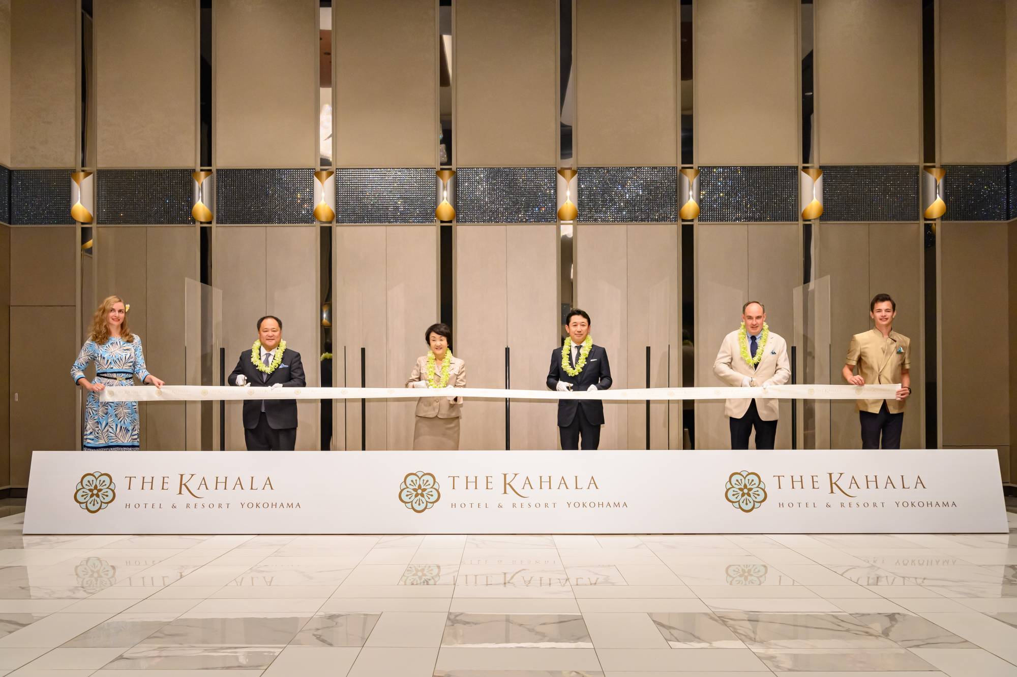 From left, Yokohama City Council Chairperson Masato Yokoyama, Yokohama Mayor Fumiko Hayashi, President of Resorttrust Inc. Ariyoshi Fushimi and hotel General Manager Michael Peter Kasch take part in a ribbon-cutting ceremony to celebrate the opening of the Kahala Hotel & Resort on Sept. 23.  | THE KAHALA HOTEL & RESORT YOKOHAMA