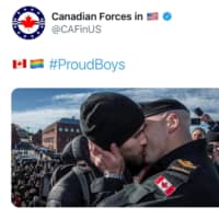 A tweet featuring a Canadian sailor kissing his partner on his return home in Victoria, British Columbia, in 2016, was posted by the U.S-based Canadian Defence Liaison Staff in response to the #ProudBoys hashtag, which saw many Twitter users send out photos of same sex couples.  | TWITTER / @CAFINUS / VIA REUTERS