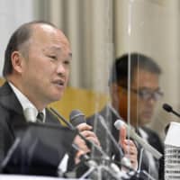 Kindai University vice president Hisao Atsumi discusses the use of cannabis by members of the university\'s soccer team at a news conference on Monday in Osaka. | KYODO