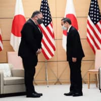 U.S. Secretary of State Mike Pompeo and Japanese Prime Minister Yoshihide Suga meet on Oct. 6 in Tokyo. Pompeo has taken a tough line on China, which could help open a space for Japan as a strategic partner of the U.S. | POOL / VIA AFP-JIJI