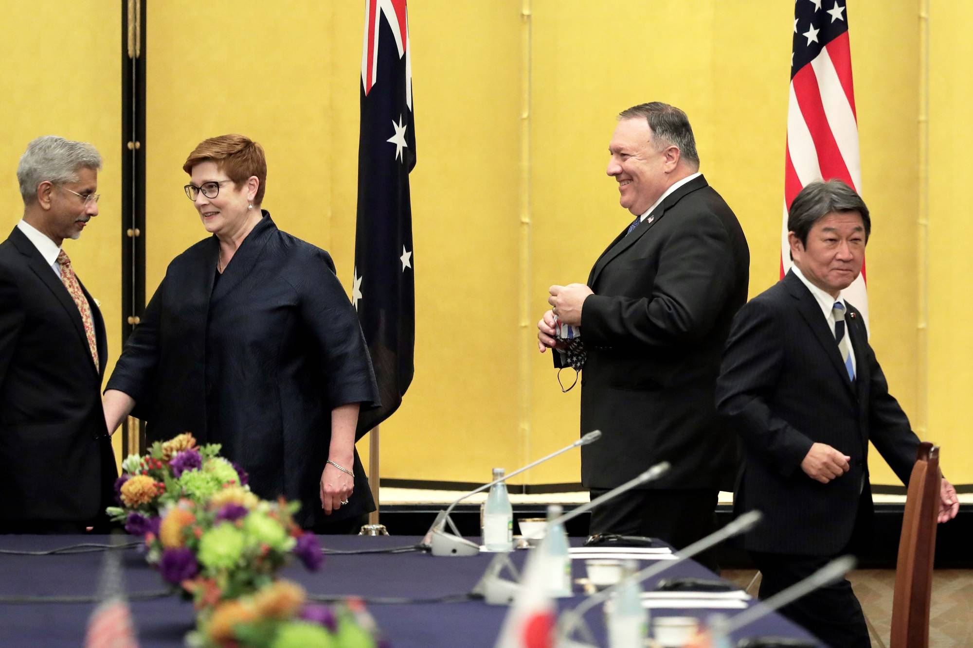 Foreign ministers from Japan, the U.S., Australia and India take their seats as they attend the four Indo-Pacific nations' meeting in Tokyo on Tuesday. | POOL / VIA AFP-JIJI
