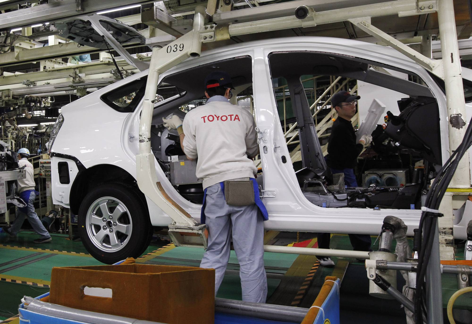 Significant improvements in exports, especially of cars, as well as in shipments of industrial goods such as steel helped lift Japan's economic assessment for August. |  REUTERS 