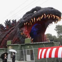 A \"life-size\" statue of Godzilla is unveiled to the press at Nijigen no Mori theme park on Awaji Island, Hyogo Prefecture, on Thursday. | KYODO
