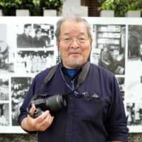 Capturing the past: Fusayoshi Kai, whose photographs are on display along the Kamo River, has been documenting life along the river for more than four decades. | RYUSEI TAKAHASHI
