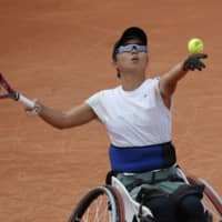 Momoko Ohtani plays a shot against Diede de Groot in the women\'s wheelchair semifinal of the French Open on Thursday in Paris. | AP