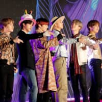 Members of South Korean boy band BTS pose during the annual MAMA Awards at Nagoya Dome in December.  | REUTERS 