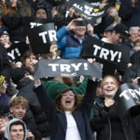 New Zealand fans cheer during the Bledisloe Cup test between the All Blacks and Australia\'s Wallabies on Sunday in Wellington. | PHOTOSPORT / VIA AP