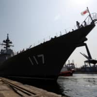 A Maritime Self-Defense Force destroyer arrives in Jakarta in September 2018. Japan\'s constitutional provisions curb just how much it can cooperate with prospective allies, limiting its global security options. | REUTERS