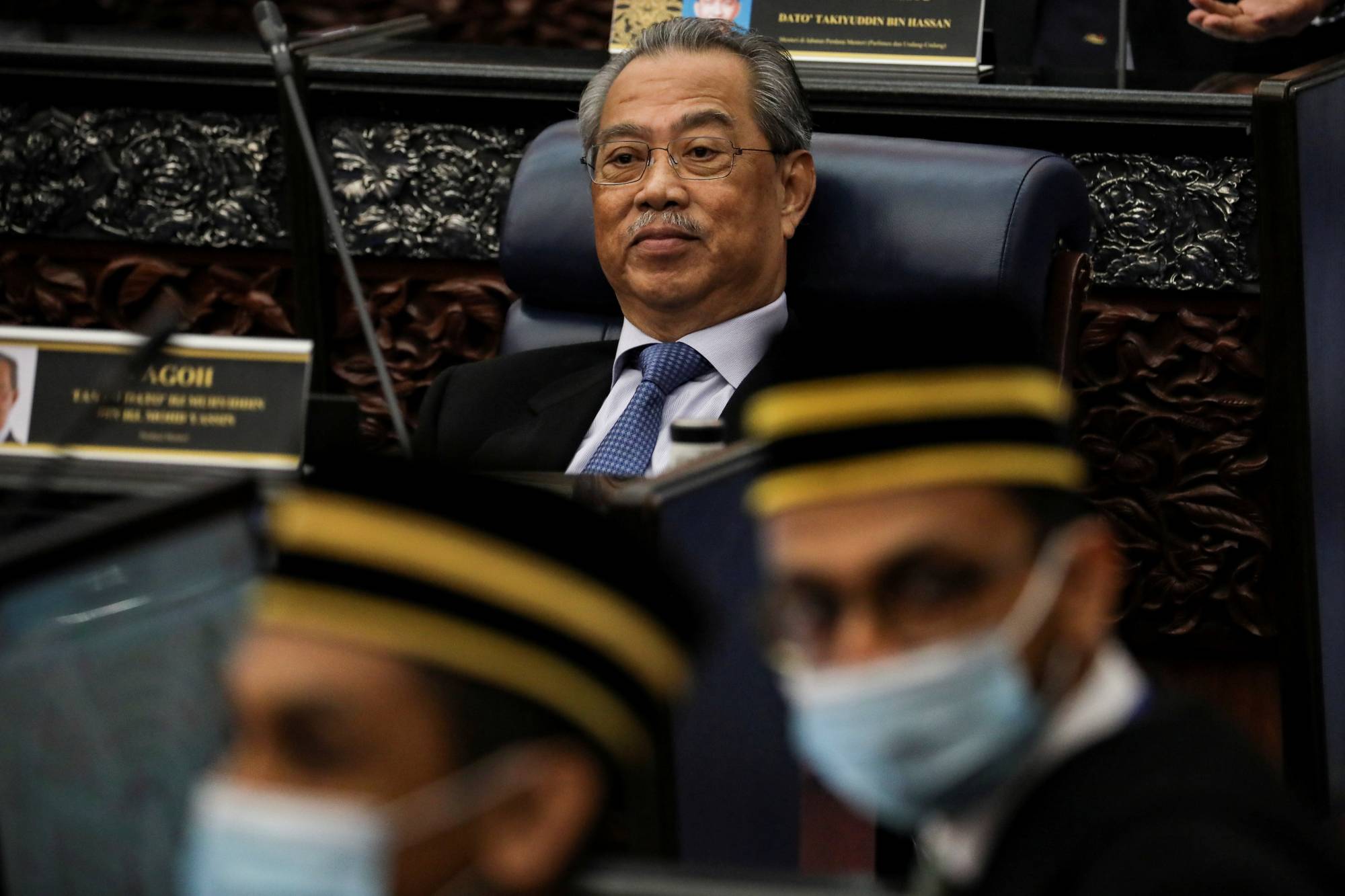 Malaysian Prime Minister Muhyiddin Yassin reacts during a parliament session in Kuala Lumpur in July.  | REUTERS 