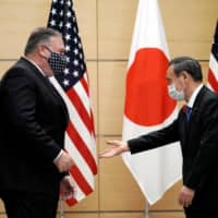 Japanese and foreign journalists have asked why Prime Minister Yoshihide Suga would visit Vietnam and Indonesia before the U.S, China or South Korea on his first official tour.  | POOL / VIA REUTERS