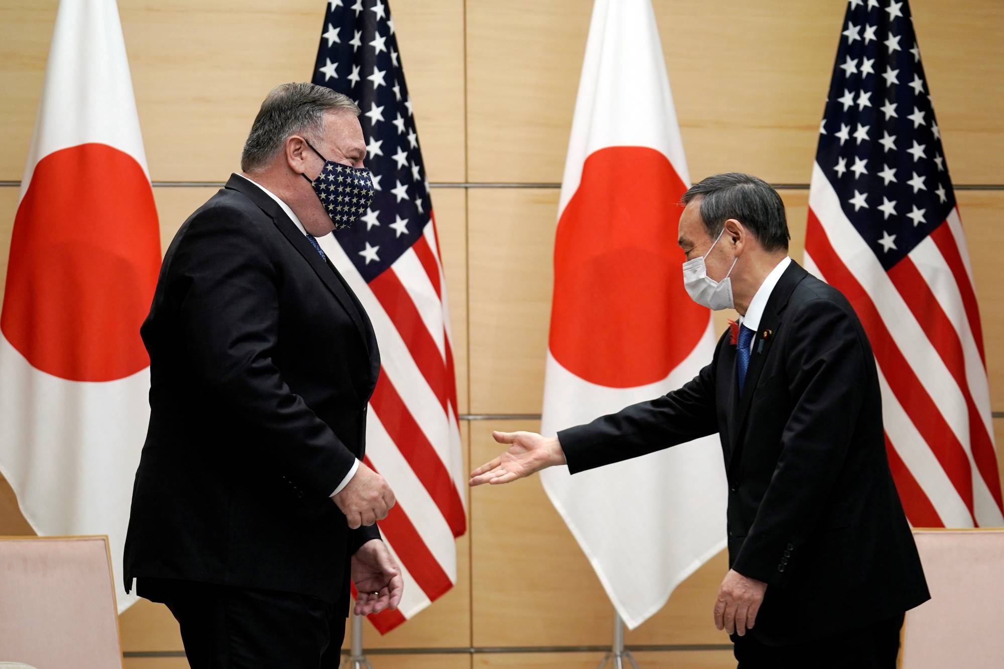Japanese and foreign journalists have asked why Prime Minister Yoshihide Suga would visit Vietnam and Indonesia before the U.S, China or South Korea on his first official tour.  | POOL / VIA REUTERS
