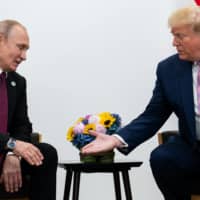 U.S. President Donald Trump meets with Russian President Vladimir Putin during the G20 summit in Osaka in June last year.  | ERIN SCHAFF/THE NEW YORK TIMES