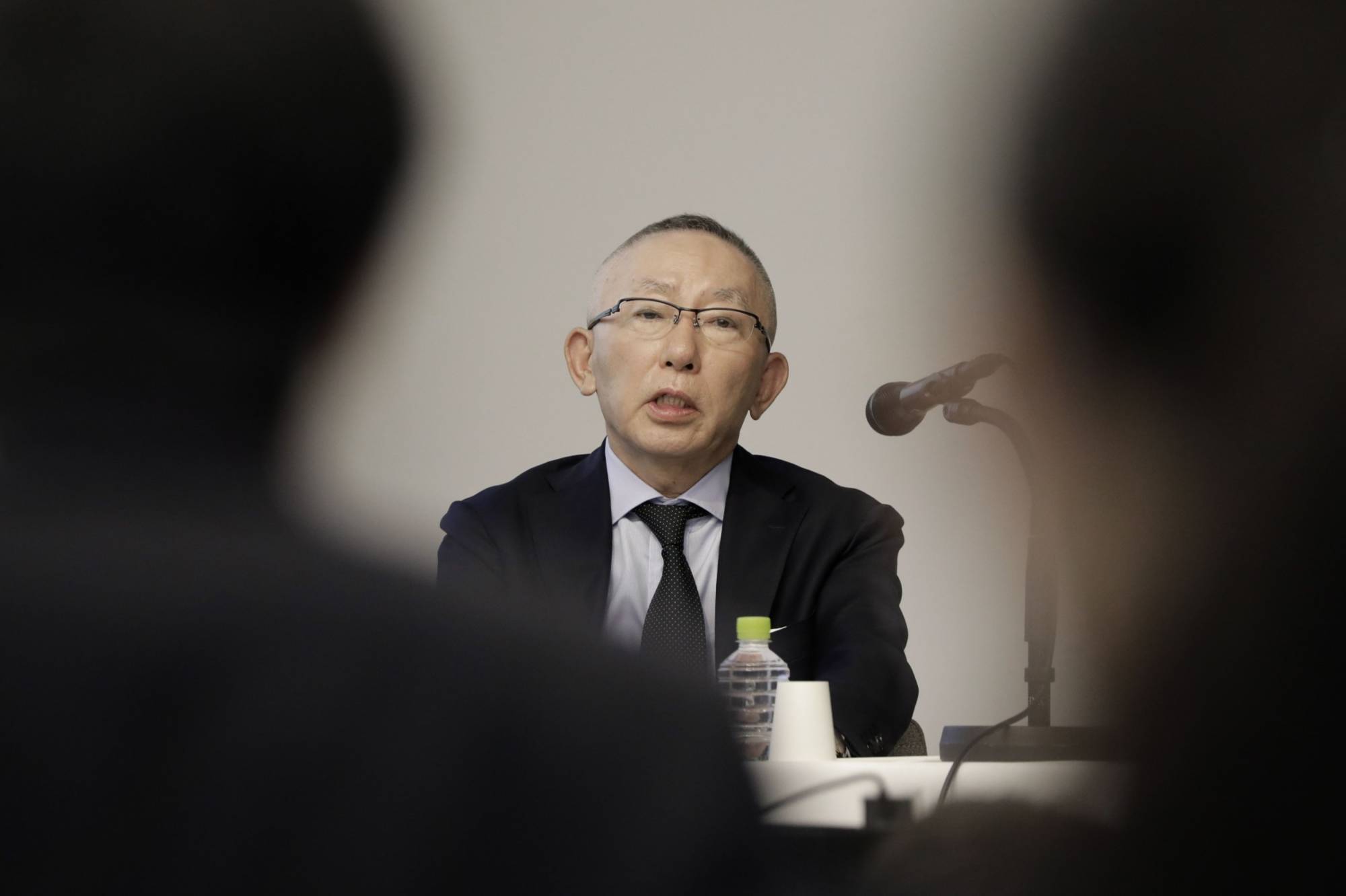 Tadashi Yanai, chairman and chief executive officer of Fast Retailing Co., speaks during a news conference in Tokyo on Thursday. | BLOOMBERG
