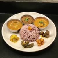Spice mix: Kalpasi’s curries come with a mound of colorful basmati rice and a variety of condiments. | ROBBIE SWINNERTON
