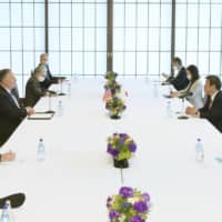 Foreign Minister Toshimitsu Motegi (second from right) and U.S. Secretary of State Mike Pompeo (third from left) hold a meeting in Tokyo on Oct. 6. | POOL / VIA KYODO