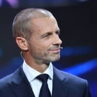 UEFA President Aleksander Ceferin participates in the Champions League draw on Oct. 1 in Geneva. | UEFA / VIA AFP-JIJI