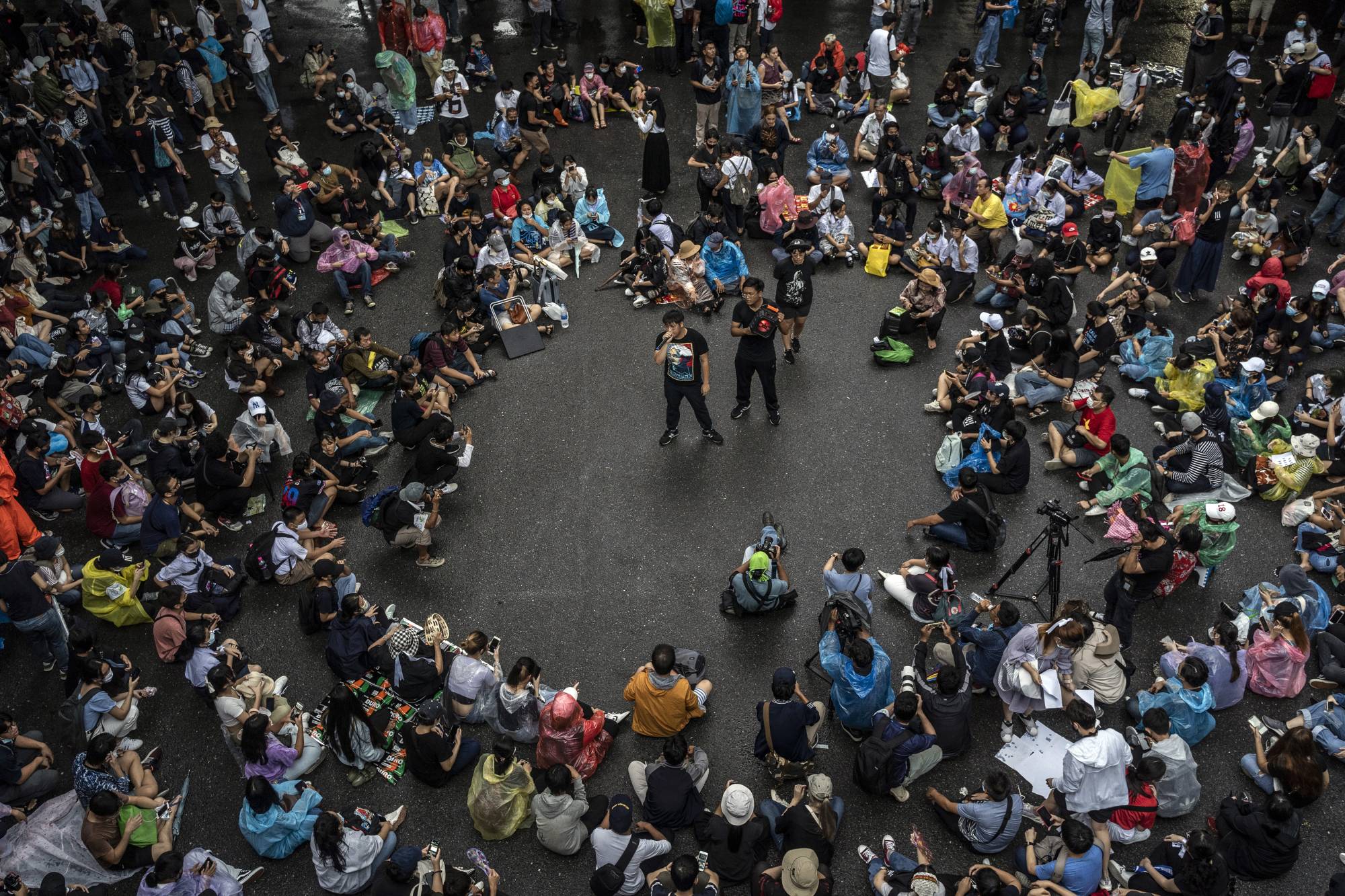 Anti-government protesters listen to speeches in Bangkok on Friday. | Adam Dean/The New York Times