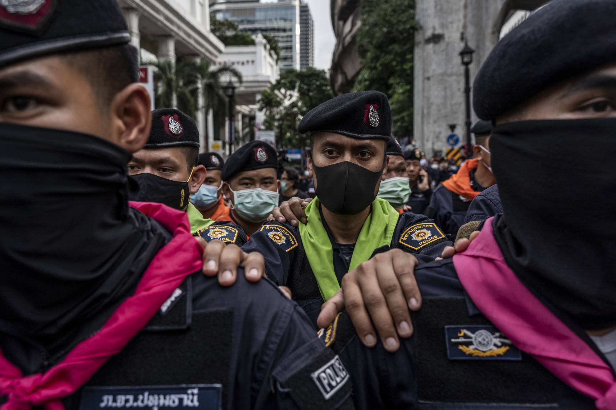 Royal Thai Police link arms to stop anti-government protesters during a protest at Ratchaprasong intersection in the commercial center of Bangkok on Thursday. | Adam Dean/The New York Times