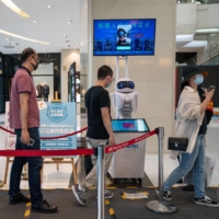 China has employed a range of AI tools in a bid to contain the coronavirus, including automated temperature scans in public places. | BLOOMBERG