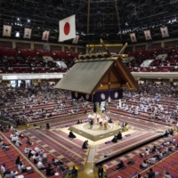Daily attendances at two recent grand sumo tournaments held at Ryogoku Kokugikan have been capped at 2,500 as part of measures to prevent the spread of the coronavirus. | KYODO