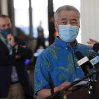 Hawaii Gov. David Ige speaks at a news conference at the Daniel K. Inouye International Airport, last Thursday in Honolulu. A new travel testing program that will allow visitors who test negative for COVID-19 to come to Hawaii and avoid two weeks of mandatory quarantine has recently gone into effect. | AP