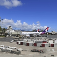 An airplane is parked at a terminal at the the Daniel K. Inouye International Airport Thursday in Honolulu. A new travel testing program has recently gone into effect, allowing visitors who test negative for COVID-19 to come to Hawaii and avoid two weeks of mandatory quarantine. | AP