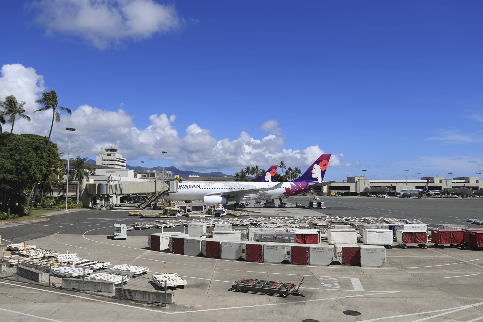 An airplane is parked at a terminal at the the Daniel K. Inouye International Airport Thursday in Honolulu. A new travel testing program has recently gone into effect, allowing visitors who test negative for COVID-19 to come to Hawaii and avoid two weeks of mandatory quarantine. | AP